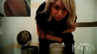 Blonde in blue underpants urinating