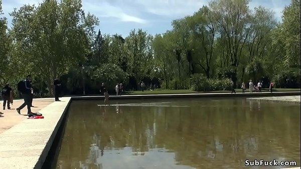 Naked Asian d. in fountain outdoor